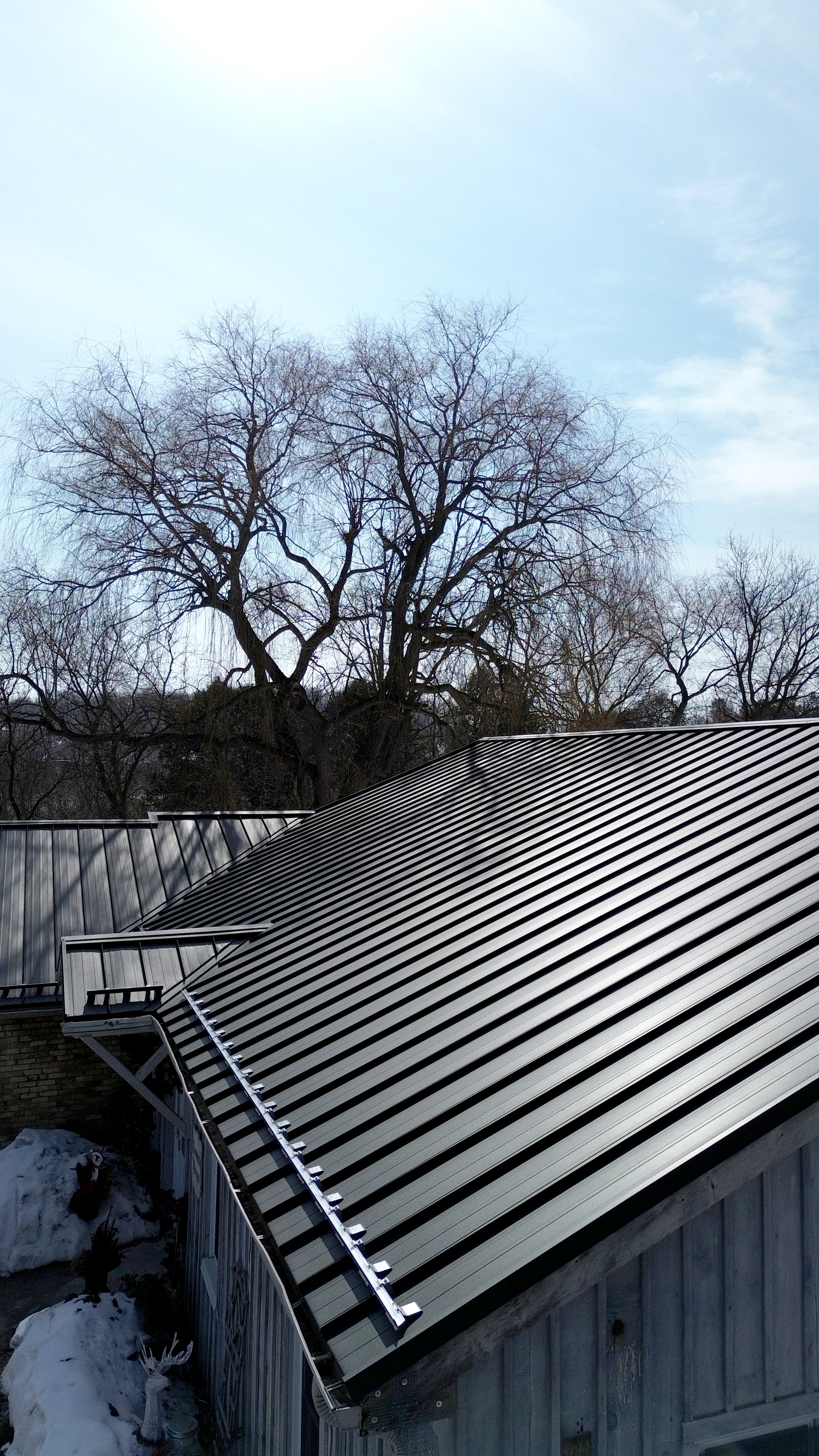 Gabled roof with metal shingles by Elgin Roofing